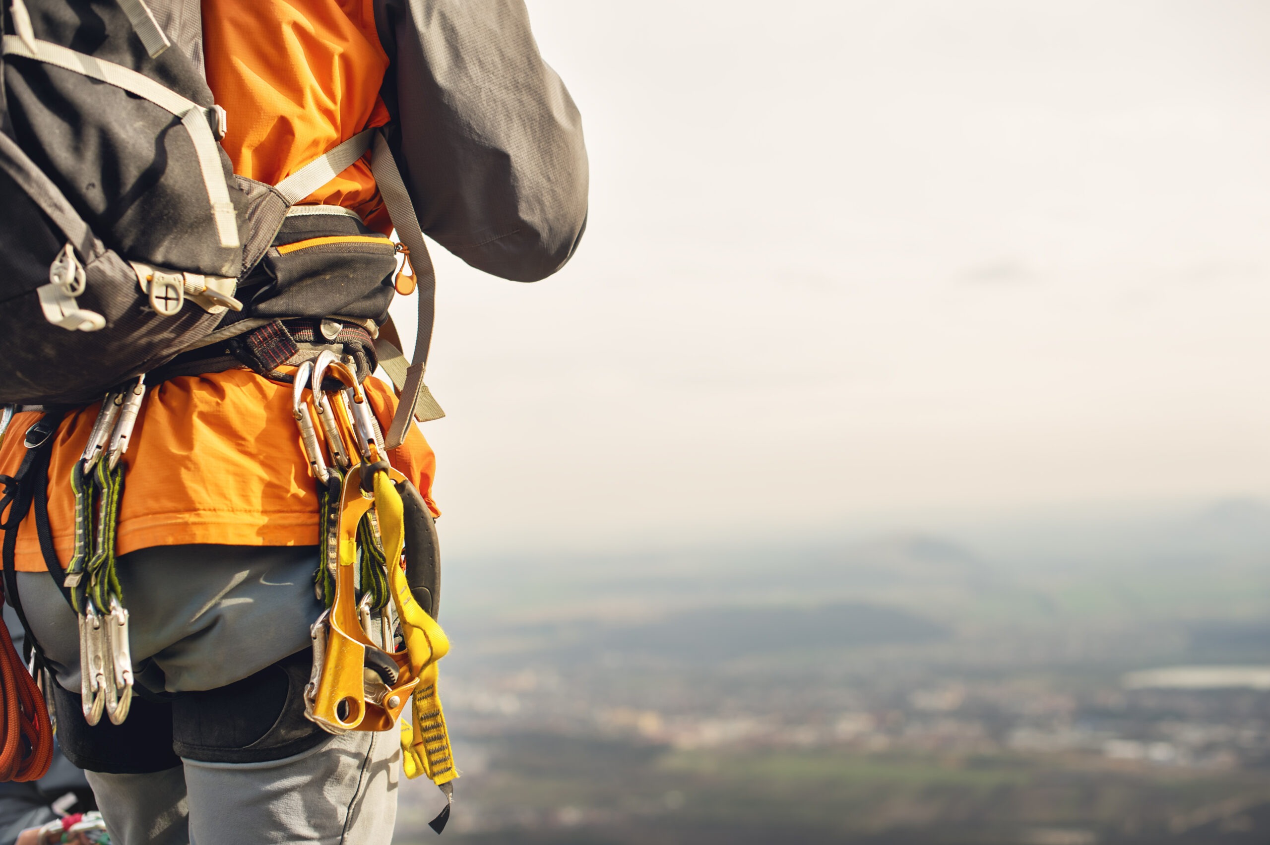 A mountain climber with various gear strapped on its body