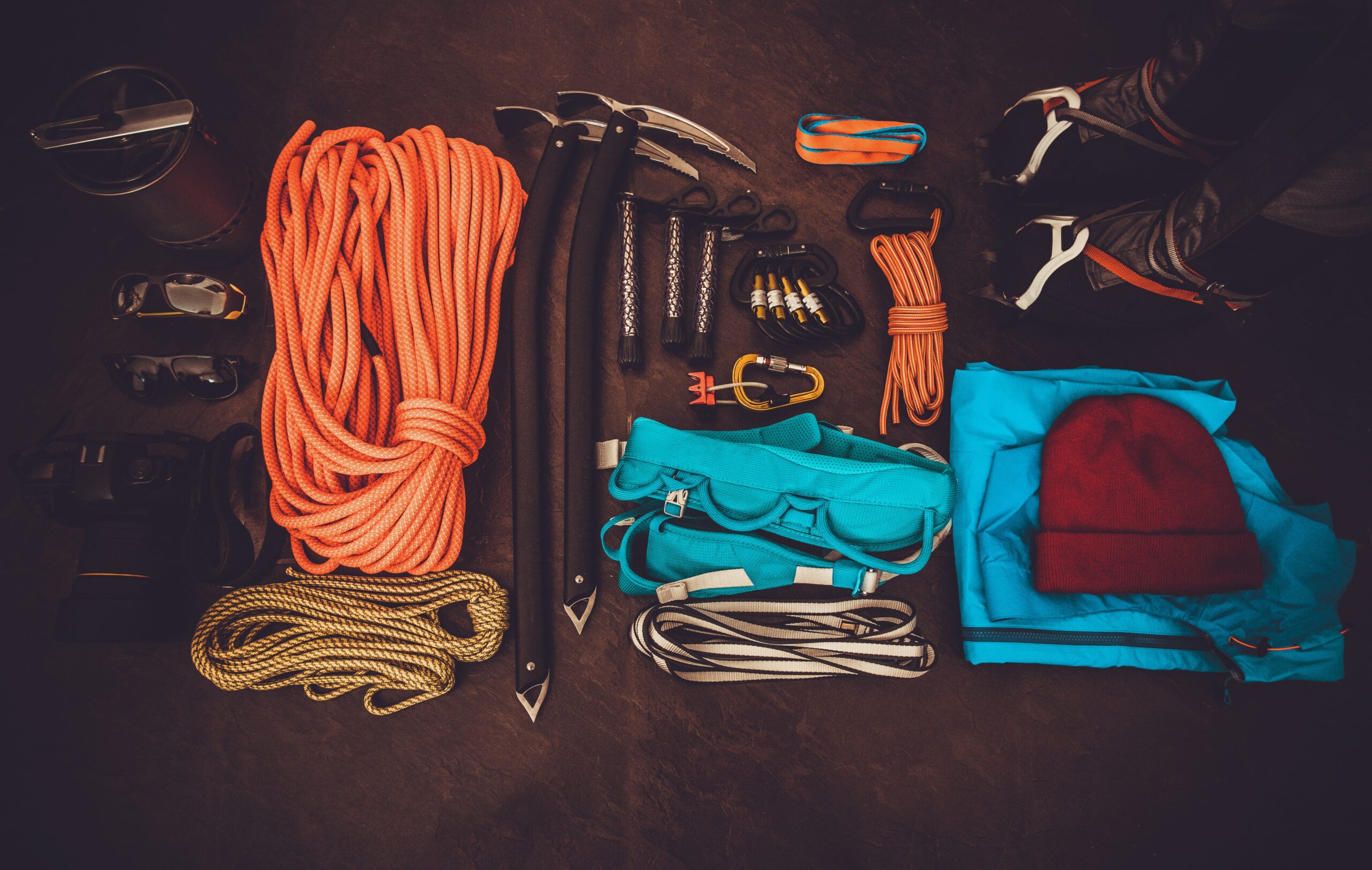 Mountain climbing equipment on a dark background