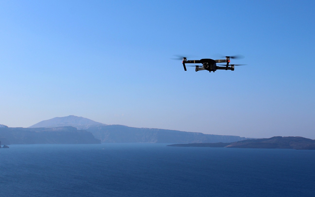 A drone flying over the ocean