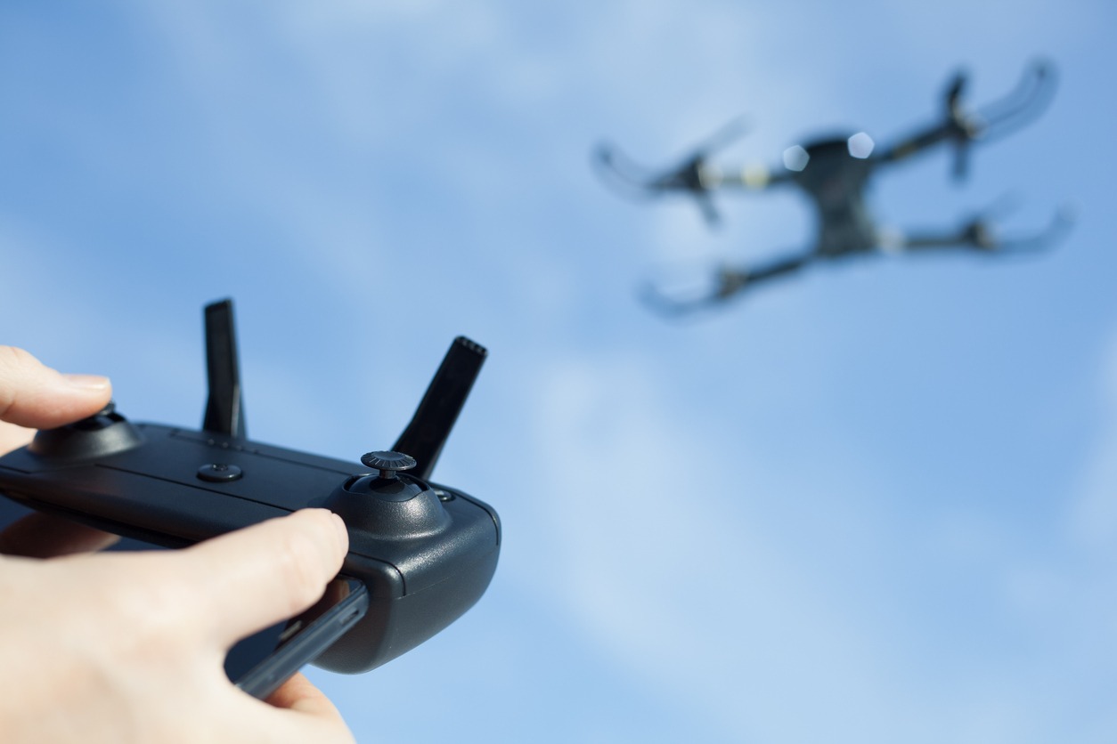 A man operating a drone
