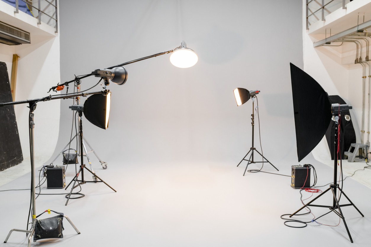 Lighting equipment strategically placed around a photo studio