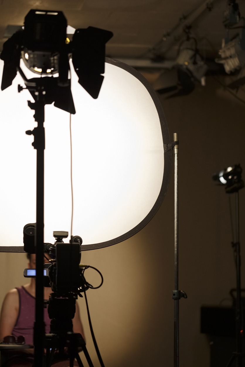 diffuser panel softening the lighting cast on the female subject 