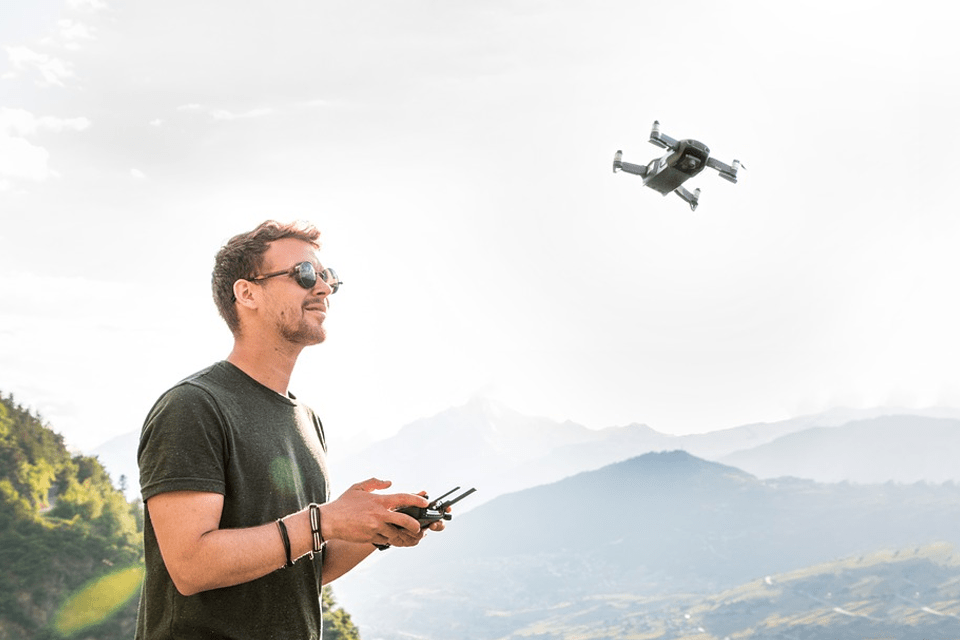 a-man-piloting-a-small-drone