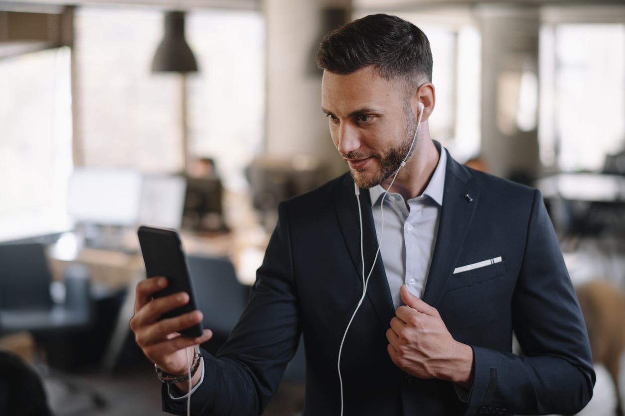 a man listening to podcast on a commute