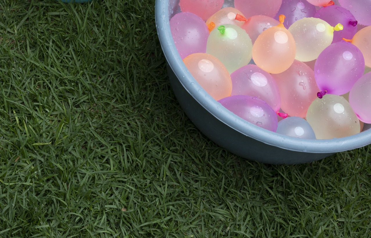 Water balloons in a swimming pool ready for a water fight