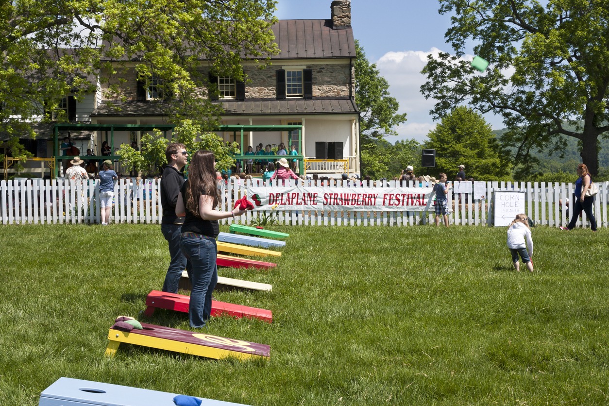 People playing corn hole