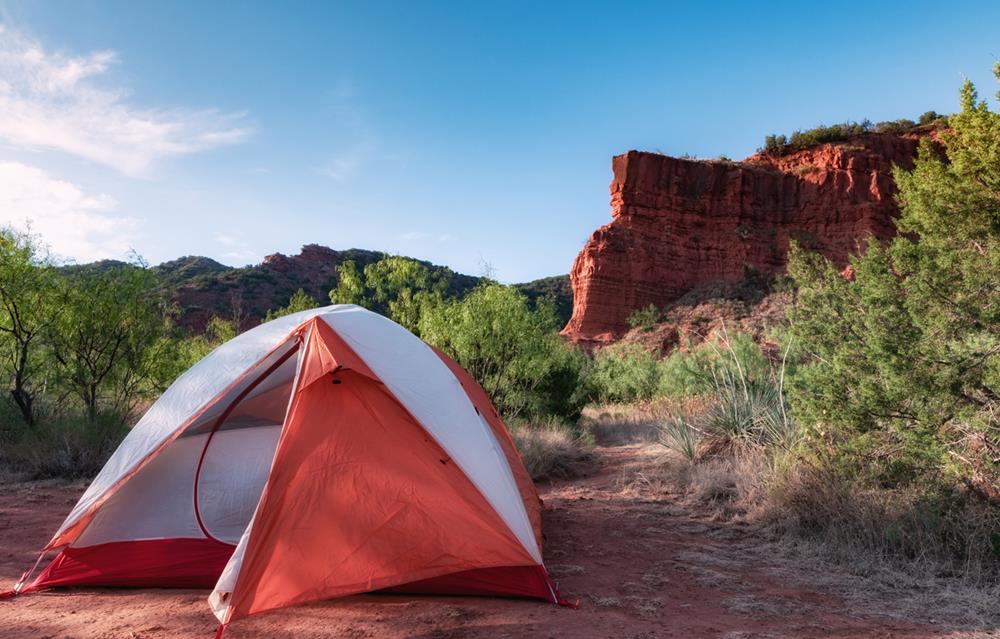 Tent in front of cliff