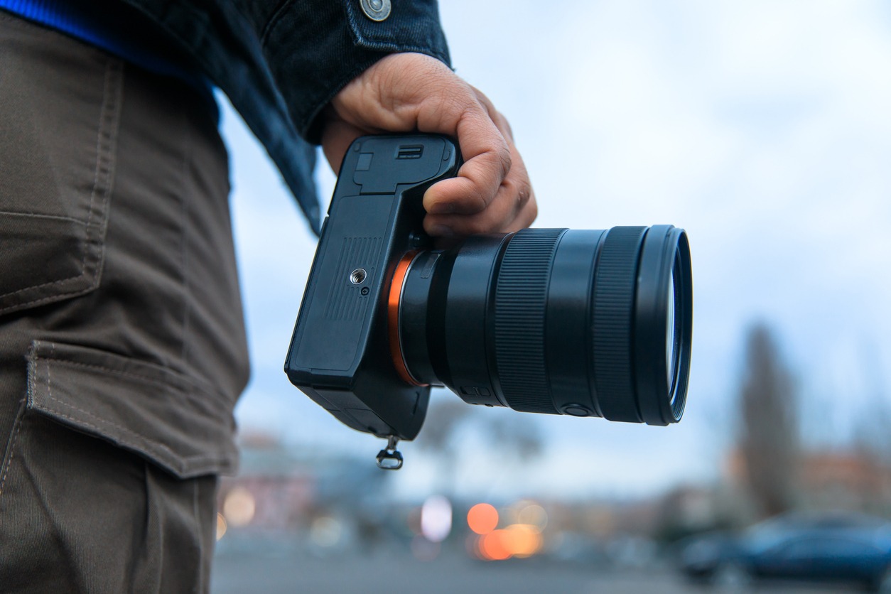 A photographer with a camera in hand. 