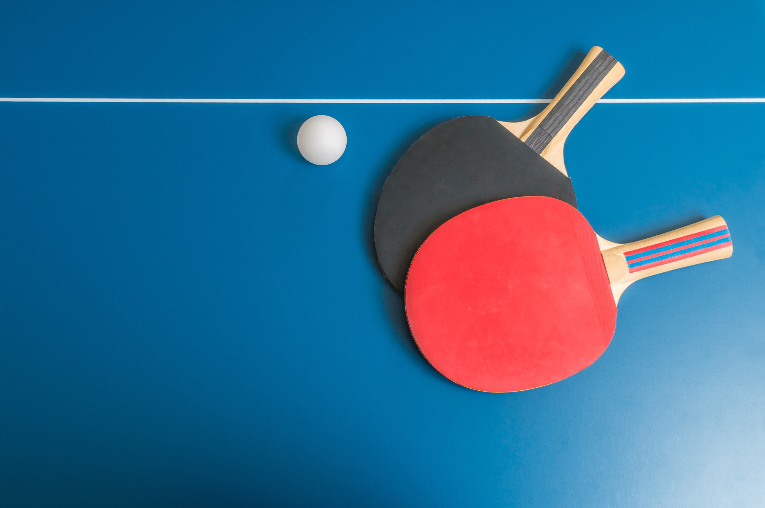 Ping pong or table tennis background with rackets