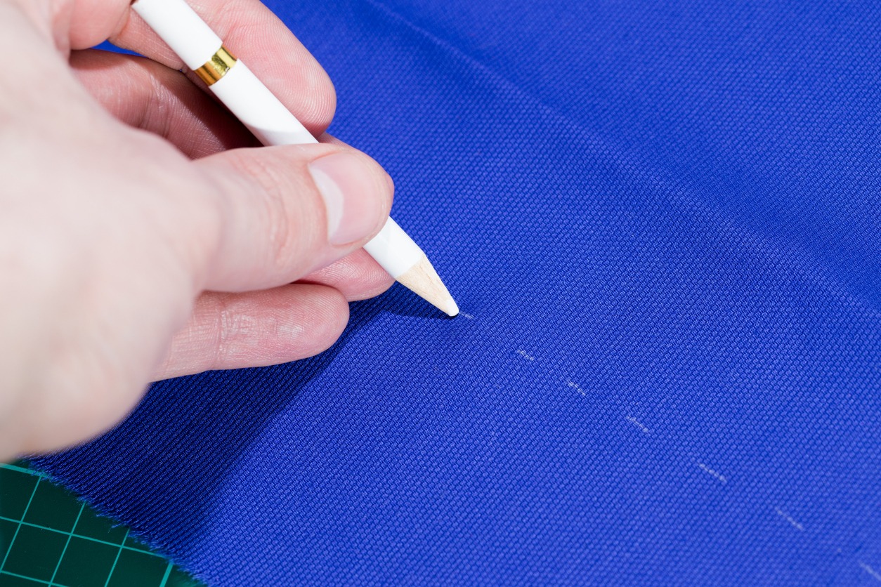 Mark cloth with special white pen