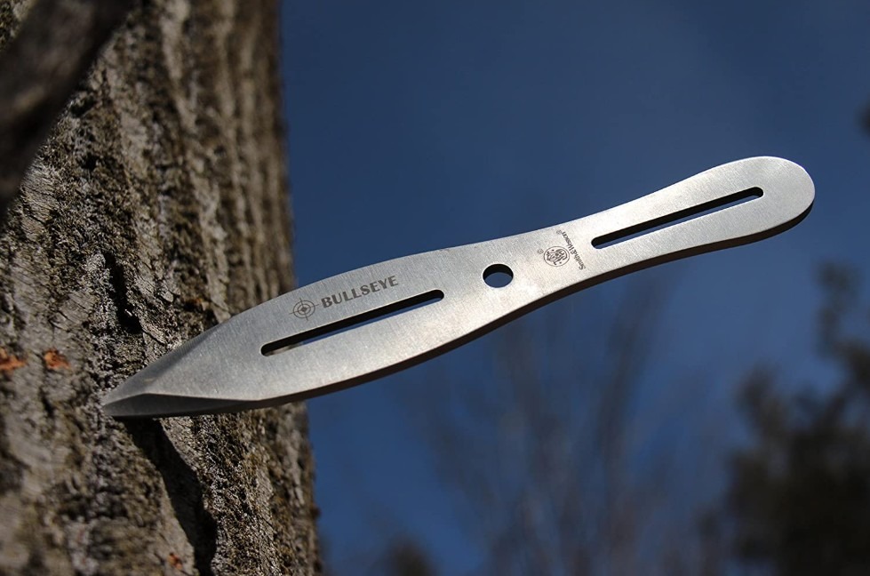 a throwing knife stuck in a tree