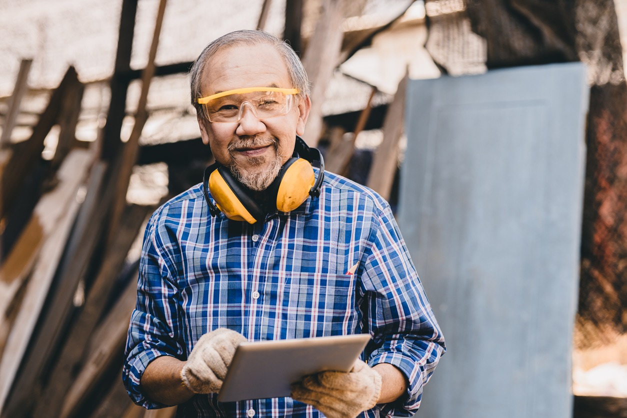 Senior male Asian worker builder