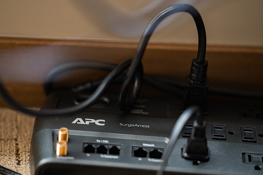a plug connected to a surge protector