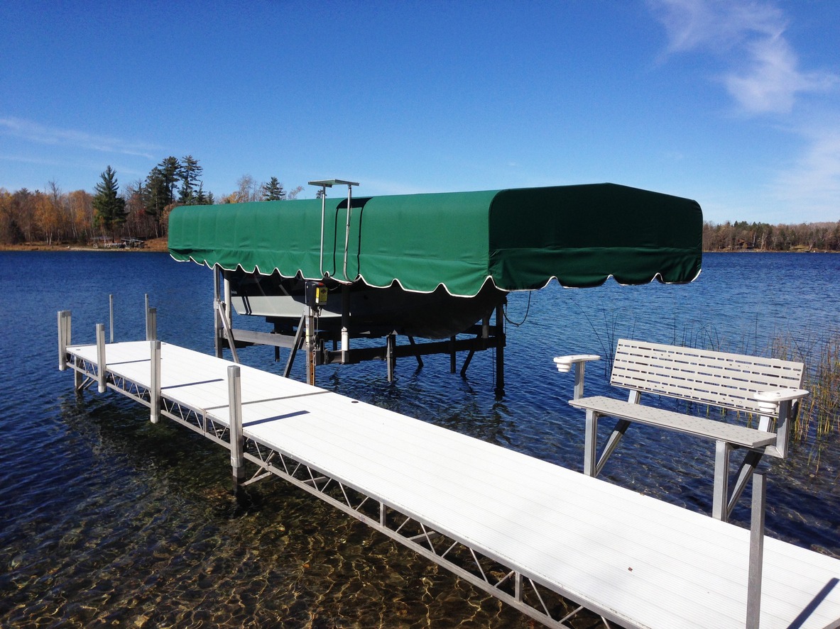 An aluminum dock and covered boat lift on northern Minnesota lake
