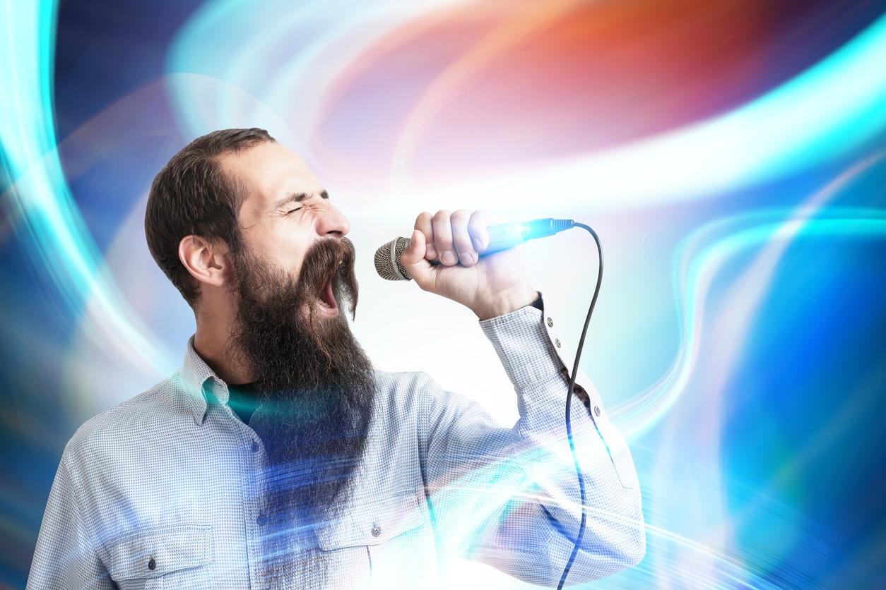 Man with a microphone, abstract background