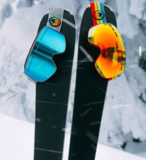 Ski goggles on a pair of skis