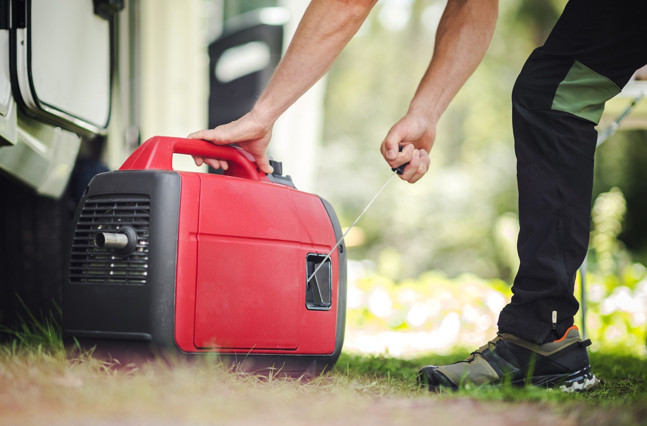 A camper starting up a portable generator