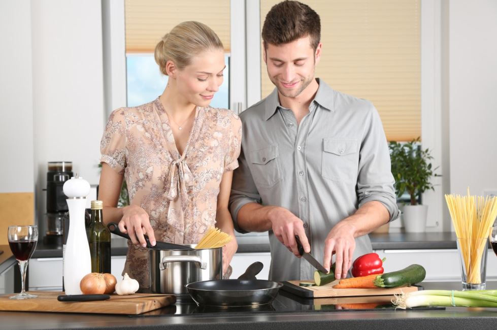 A couple cooking at a kitchen