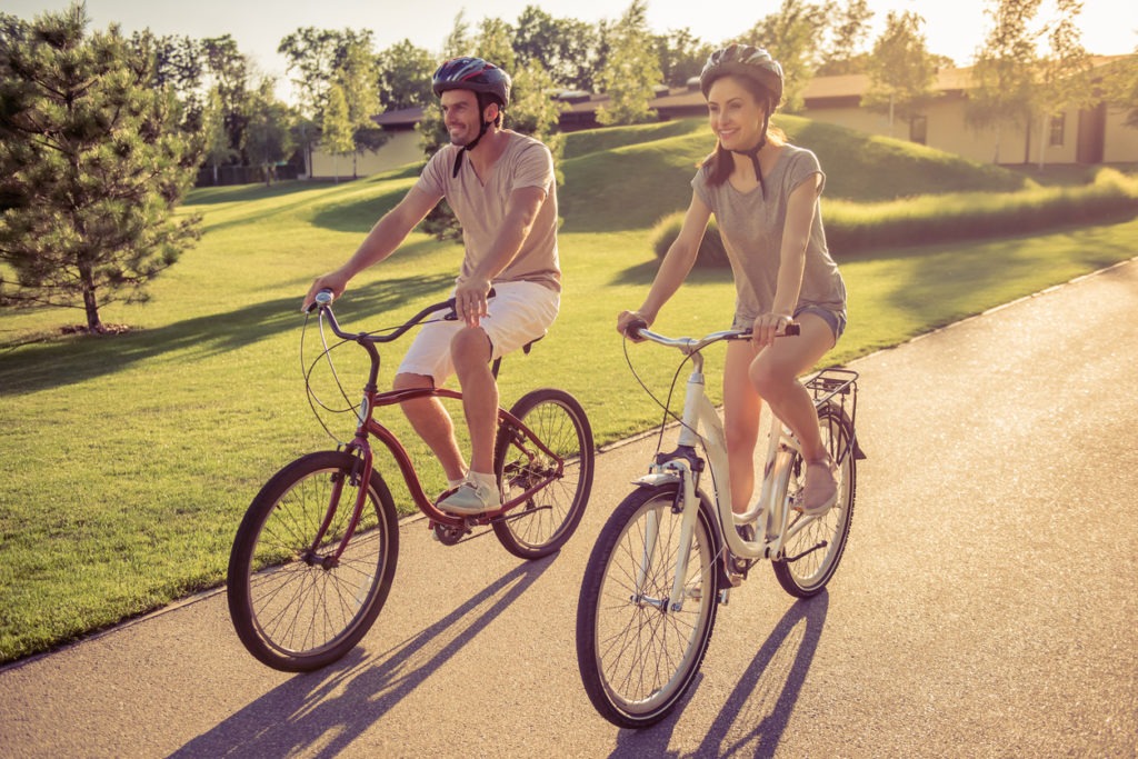 A couple riding a bike together