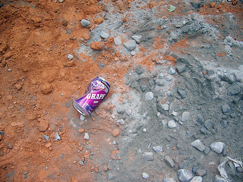 Discarded beverage can used in Kick the Can street game