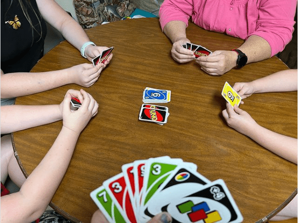 Friends playing Uno