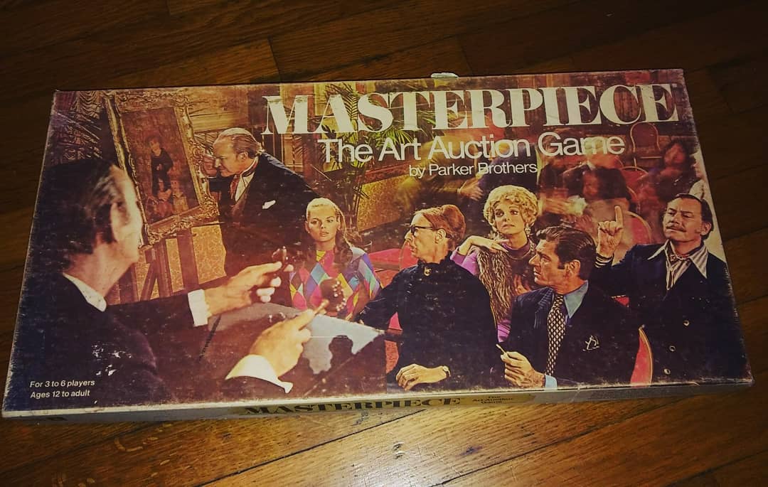 Masterpiece 1970s edition game box on a wooden table
