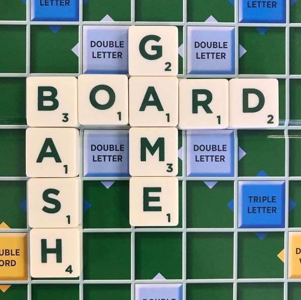 Words board, game, and bash in a game of Scrabble