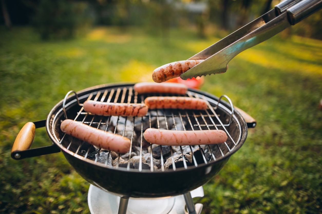 Close-up image of sausages on grill outside