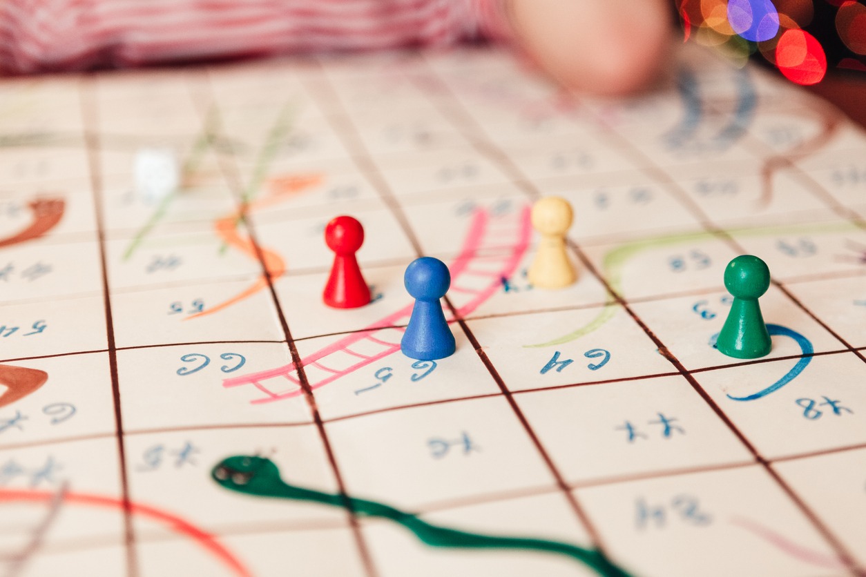 Hand-drawn game Snakes and Ladders. Close-up
