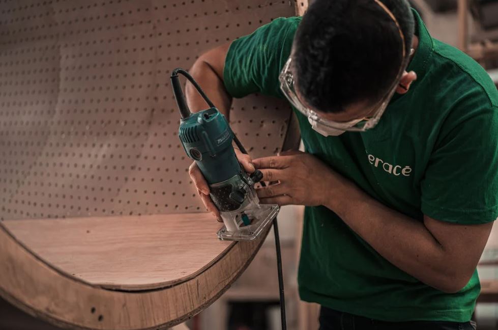 man using a wood router
