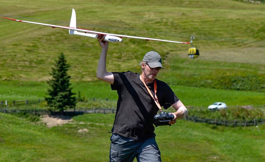 person launching an RC plane