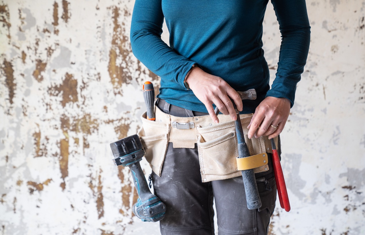 A construction worker with a tool belt
