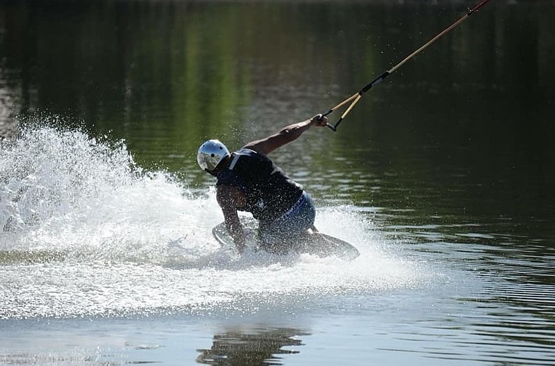 A-man-kneeboarding-by-the-river (1)