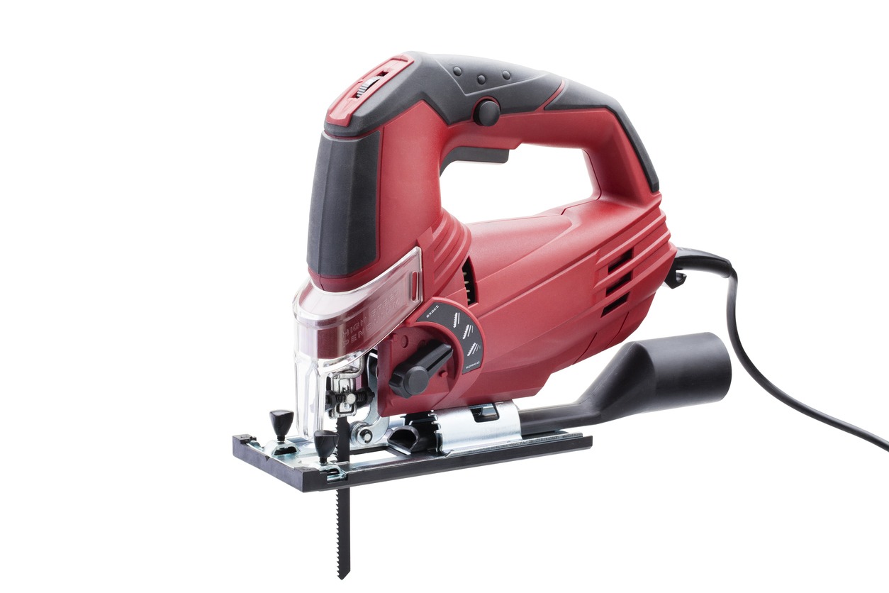A red electric jigsaw power tool