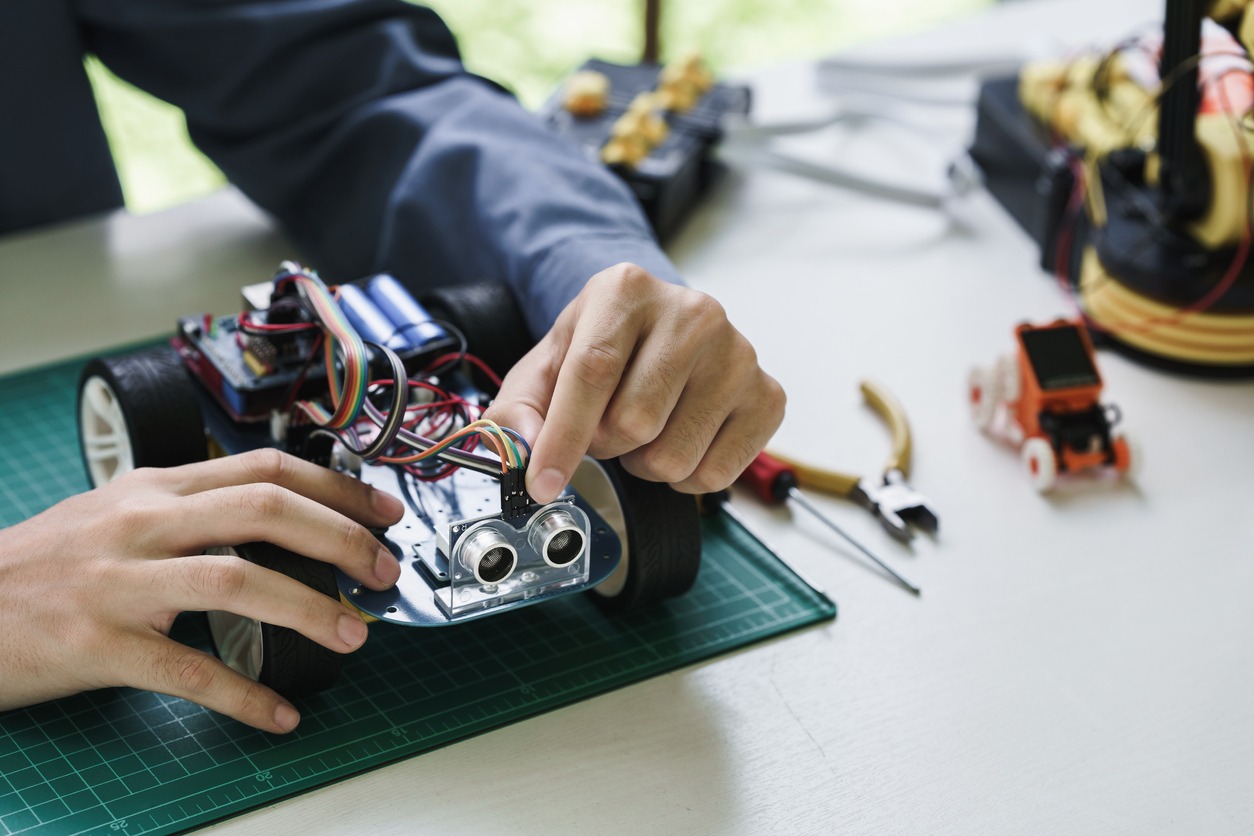 A student working on a robotic car