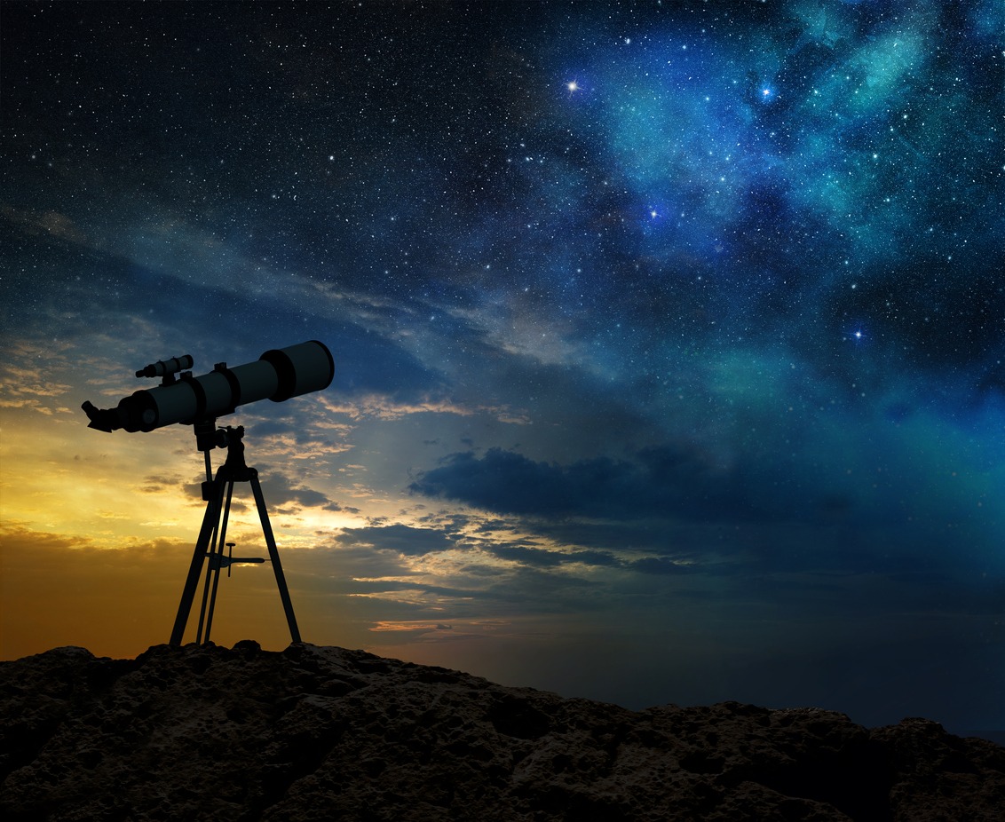 A telescope set to observe the milky way at dawn