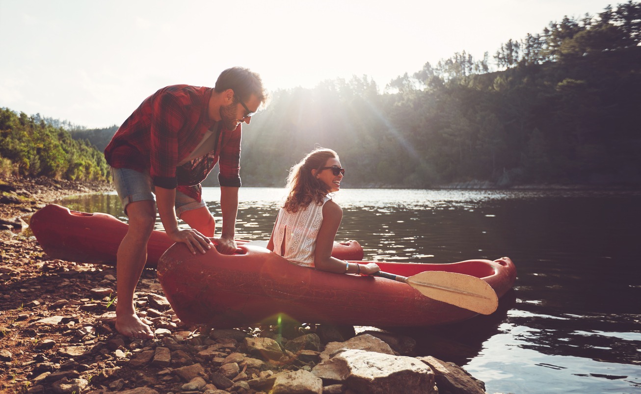 Couple going for kayaking in lake