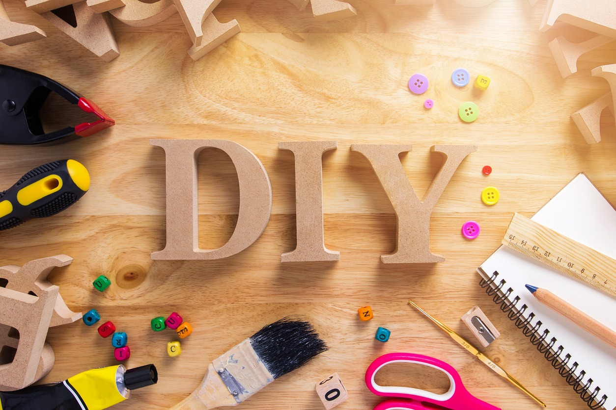 DIY Wood Font Style On a Wooden Workbench Top View.Do it Yourself concept
