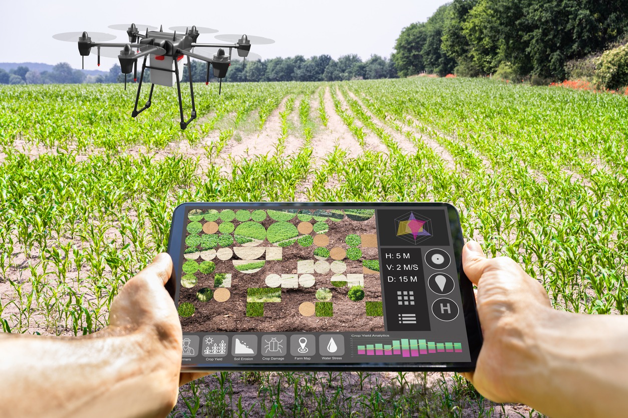 Farmer using a drone remote controller