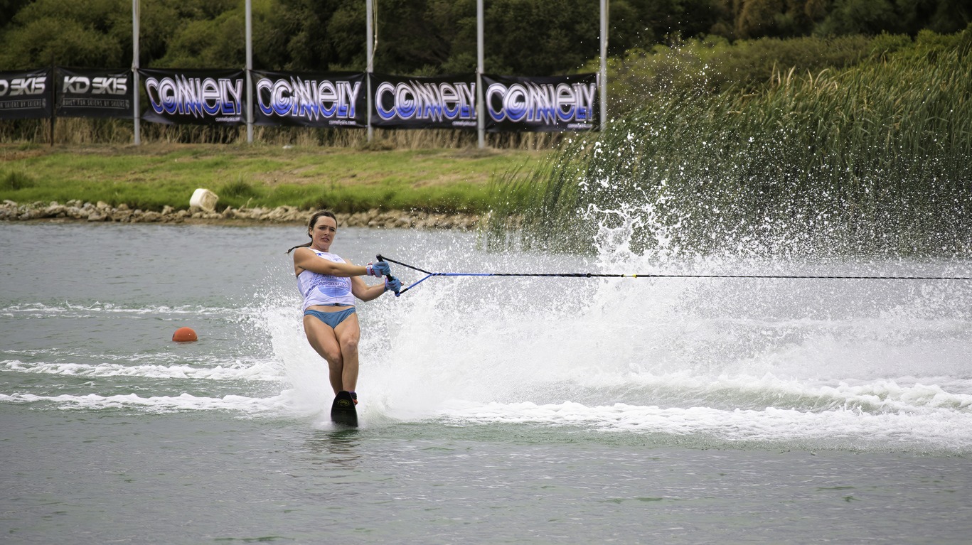 Female competitor crossing the wake at National Water Ski Championship at Max Kirwin Water Ski Park