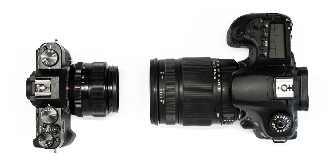 Mirrorless and DSLR Camera facing each other