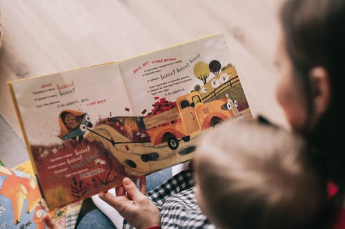 Mother-reading-book-to-child