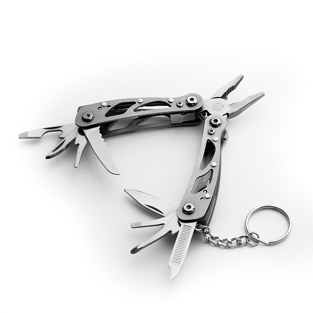 Multi-tool with expanded tools and pliers isolated on a white background. Free space for the label or logo, layout, and mockup
