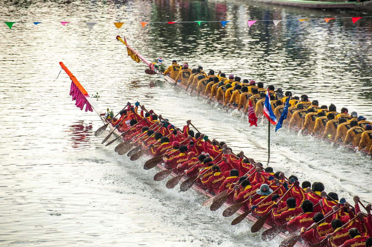 Pathumthani, Thailand - October 28,2012: Two rowing teams in full speed during Thai Long-tailed Boat Competition for Royal Championship Cup in Rangsit, Pathumthani, Thailand