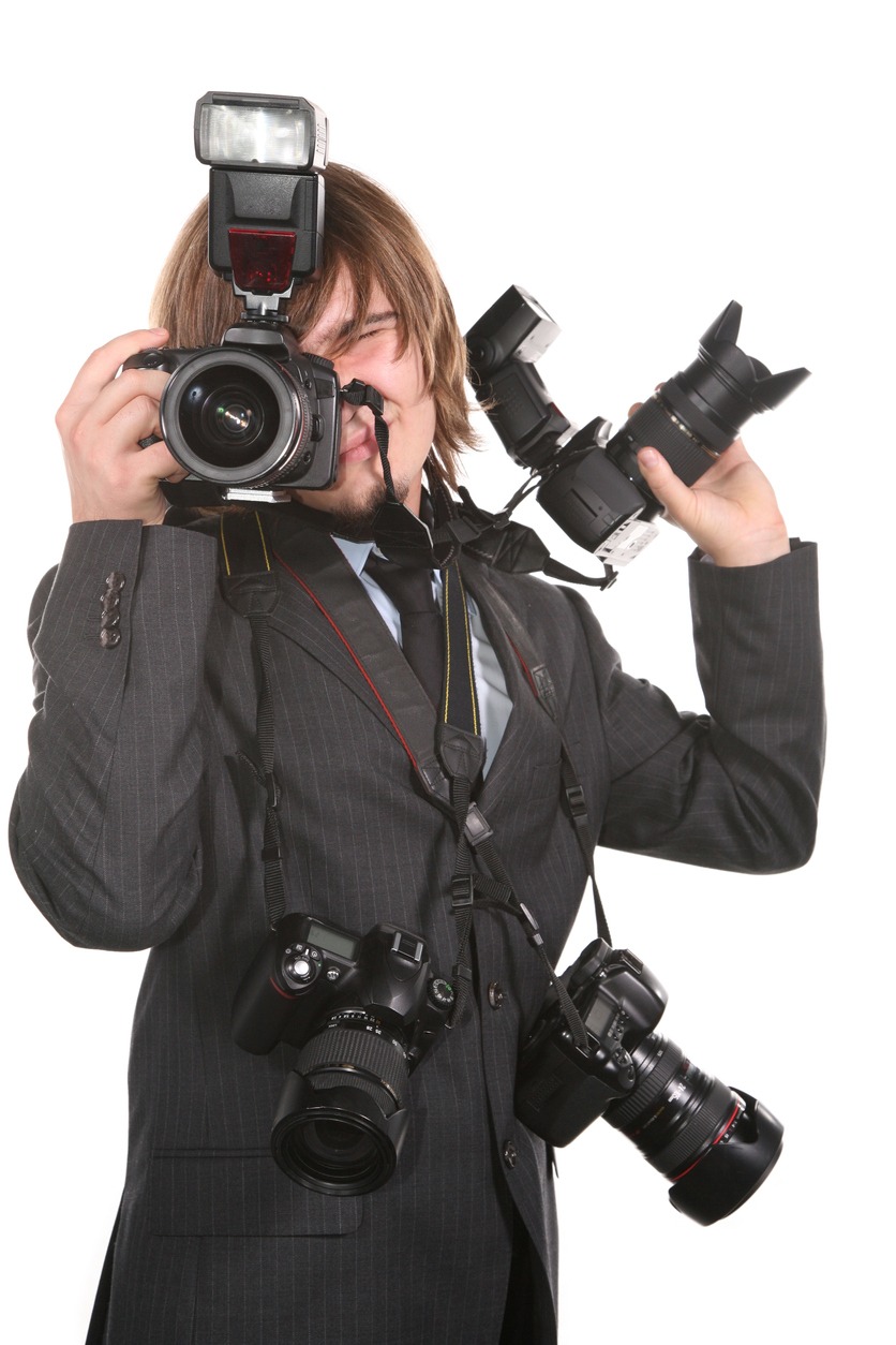 Young man with four cameras stock photo