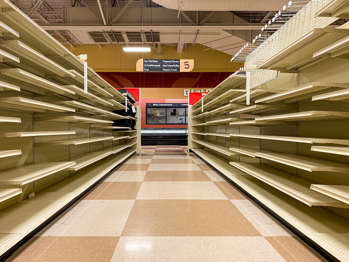Empty Grocery Store Aisle With No Products Available After Sell Out