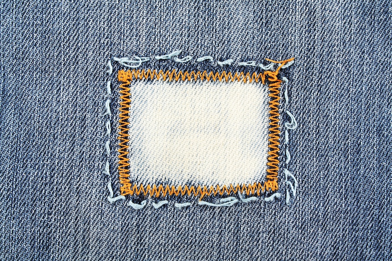 patch on blue jeans