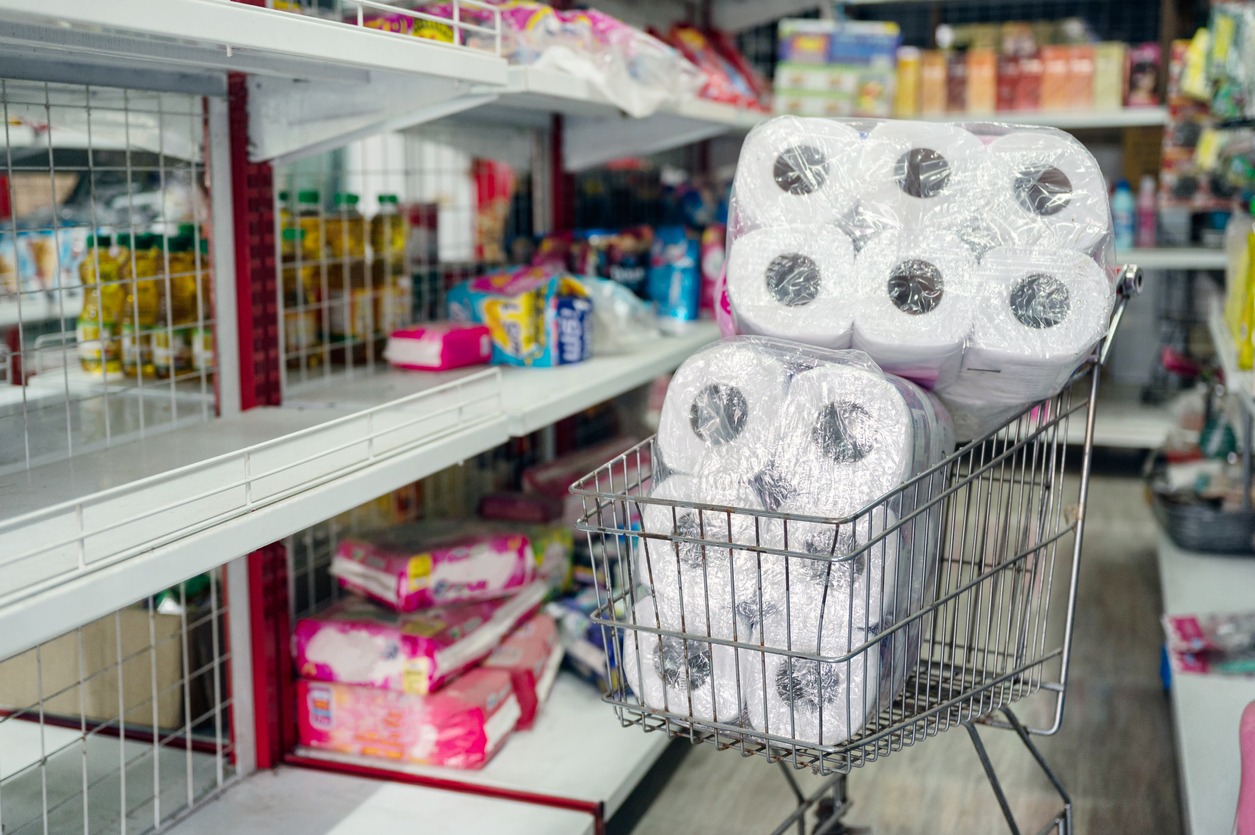 Customer hoarding tissue, and toilet paper on the shopping cart in the retailer. During epidemic of Coronavirus, Covid-19