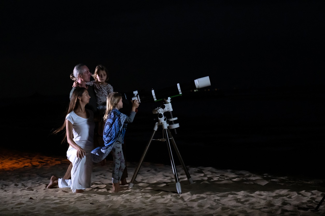 Family looking at moon and Stars