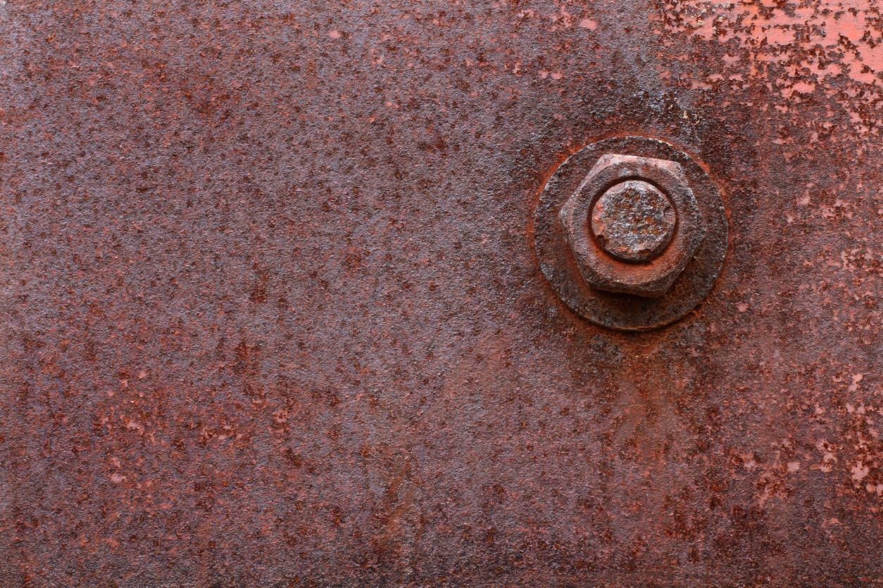 Rusted bolt on a rusted sheet of metal
